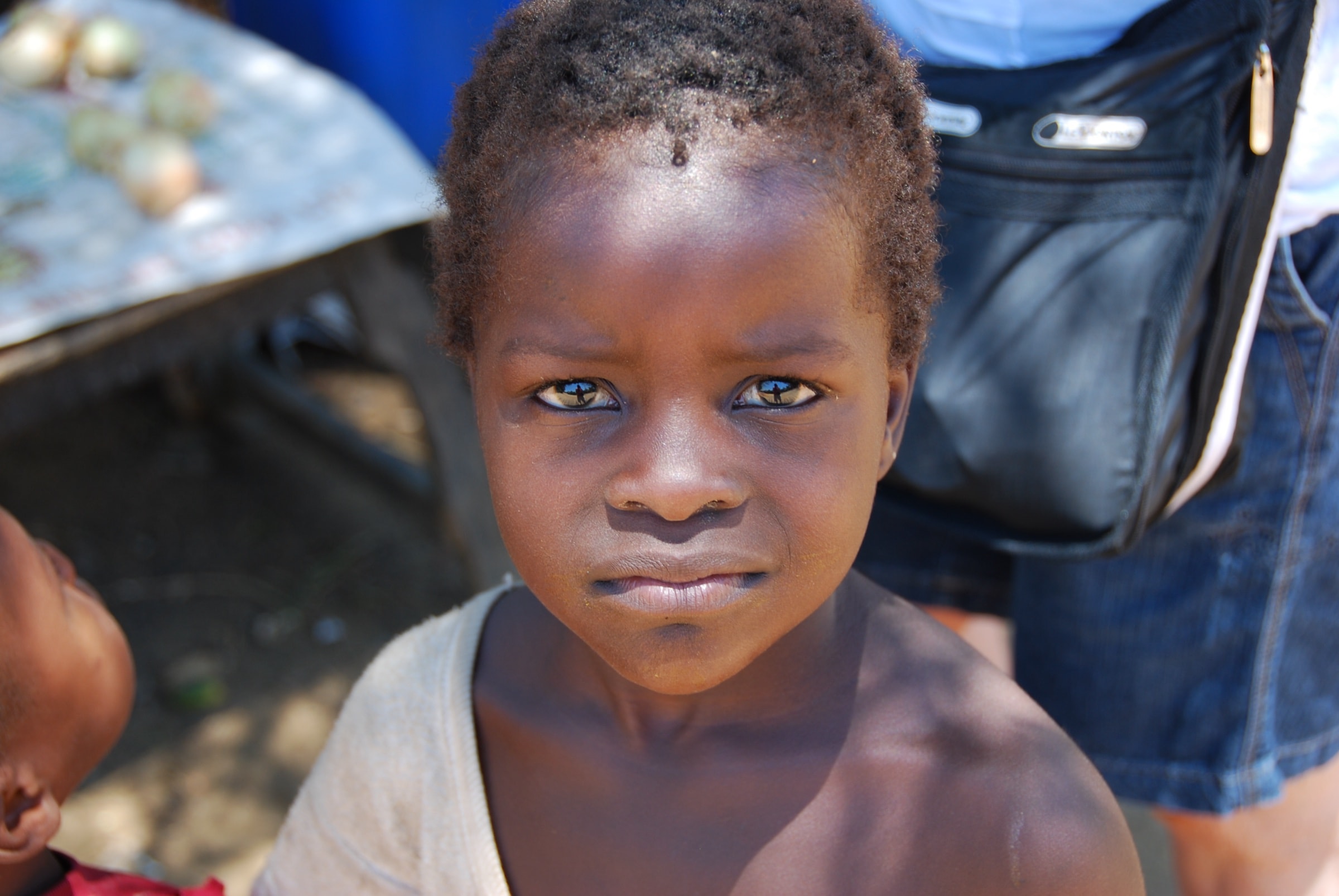 A toddler looking straight at the camera